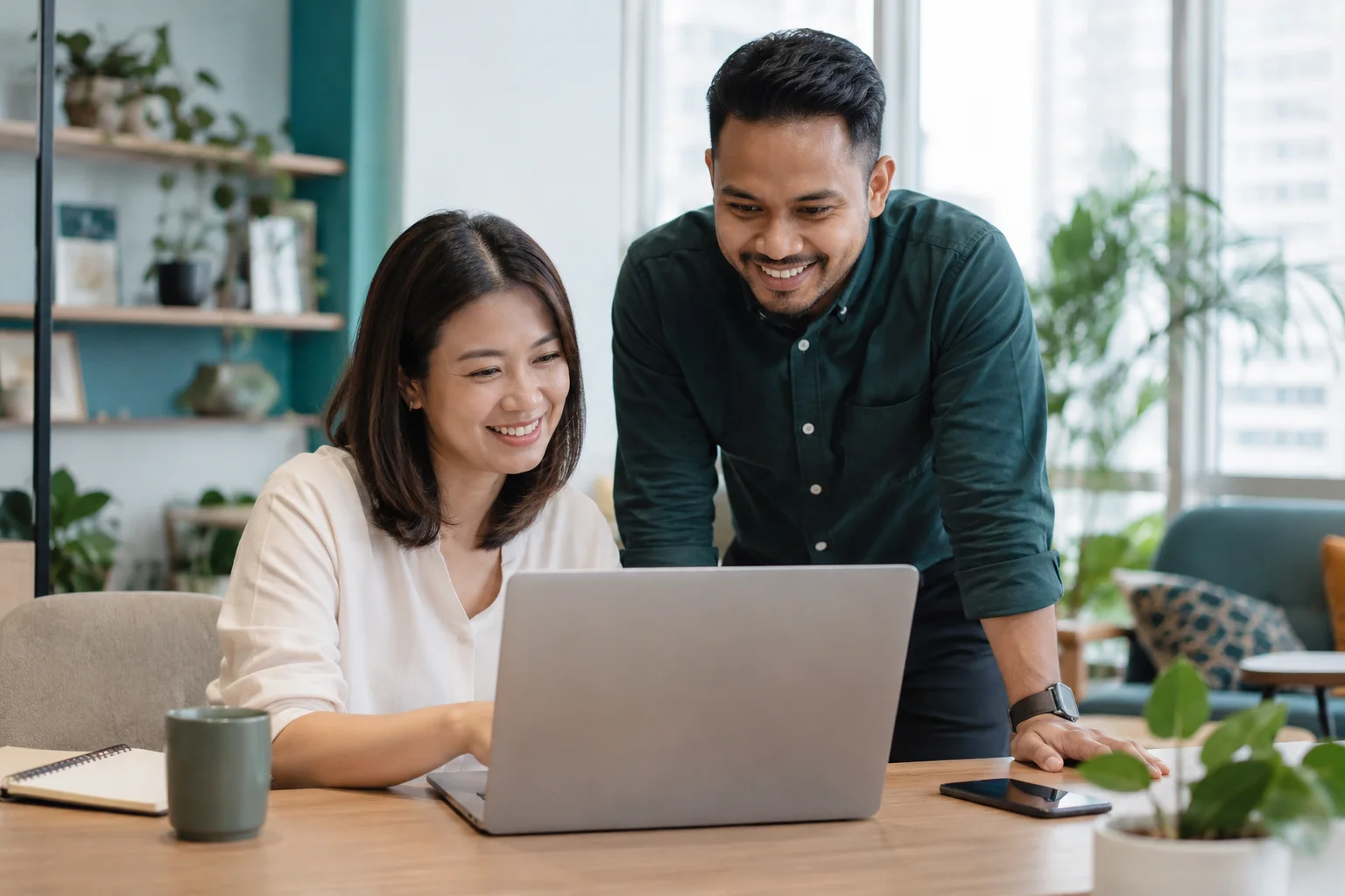 Illustration of colleagues collaborating in a bright office
